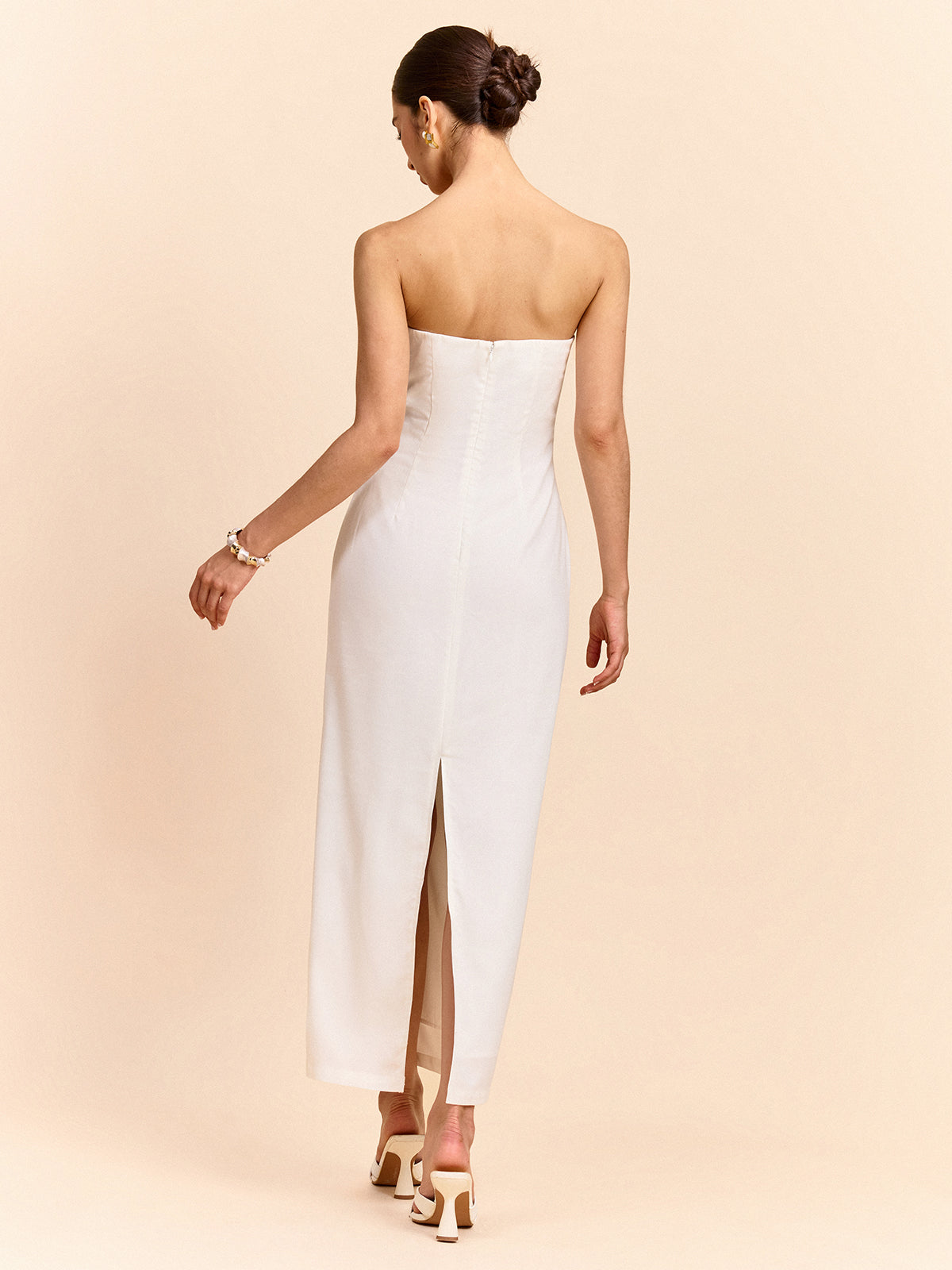 Strapless maxi dress with elegant floral design in light fabric and refined tailoring.