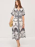 LA FINE FLEUR Bohemian Floral V-Neck Midi Dress with black floral pattern and wide belt.