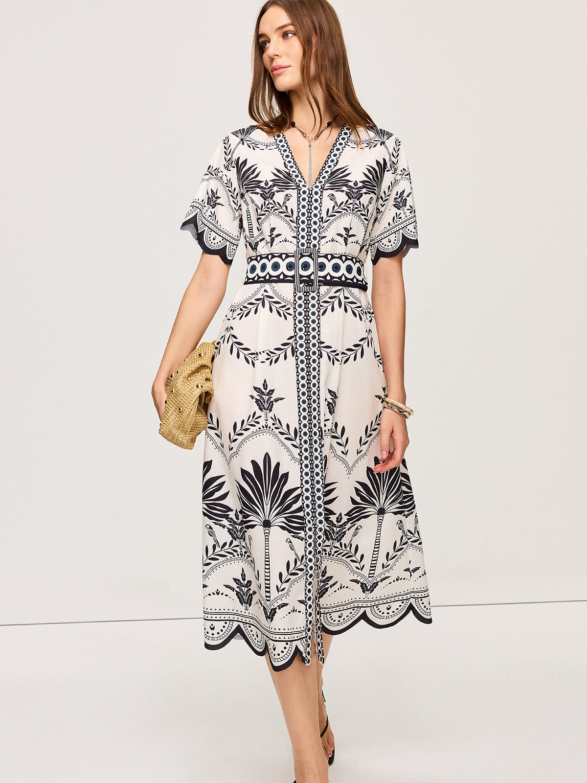LA FINE FLEUR Bohemian Floral V-Neck Midi Dress with black floral pattern and wide belt.