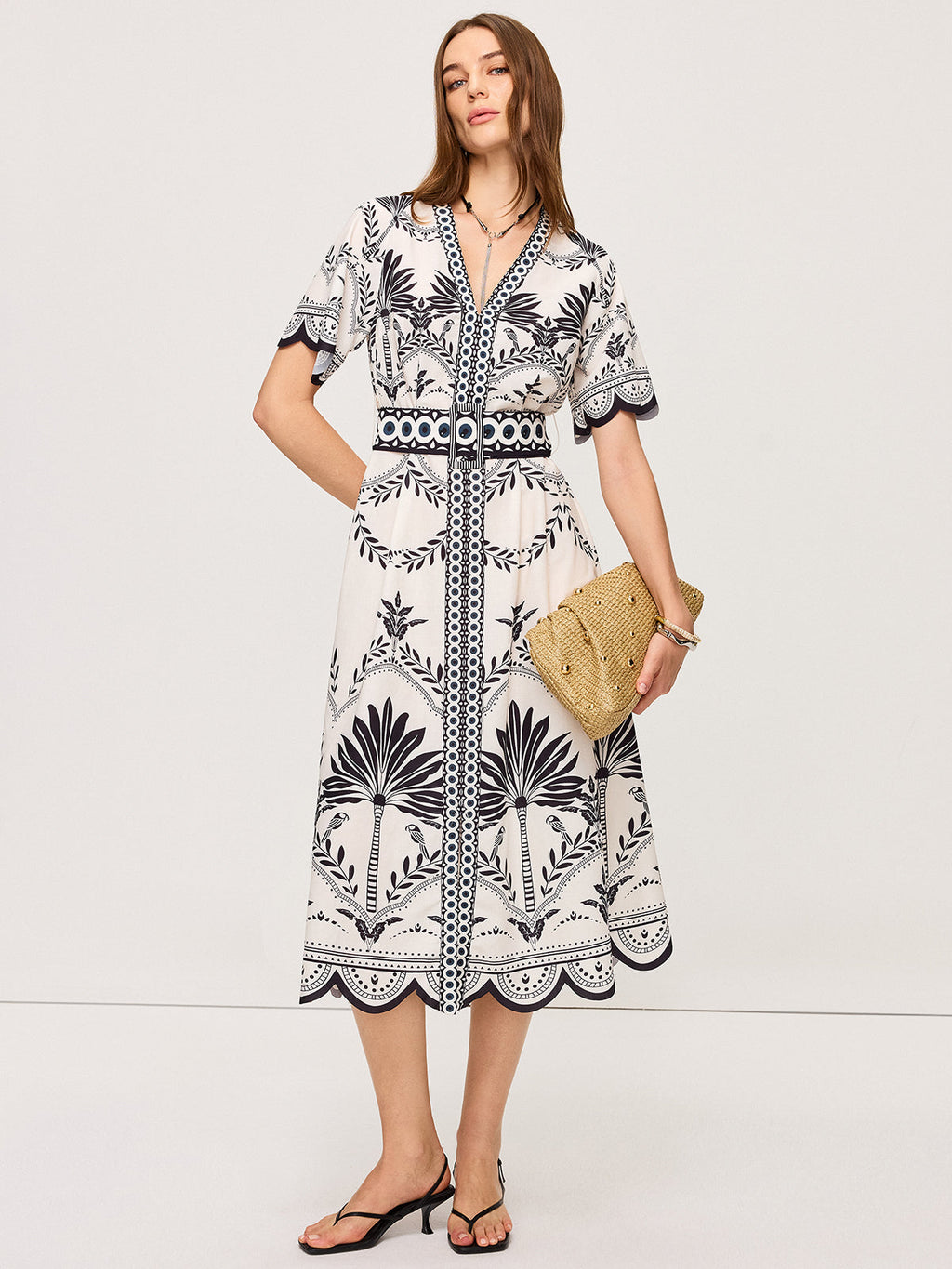 Bohemian Floral V-Neck Midi Dress with black floral and geometric patterns, belted waist.
