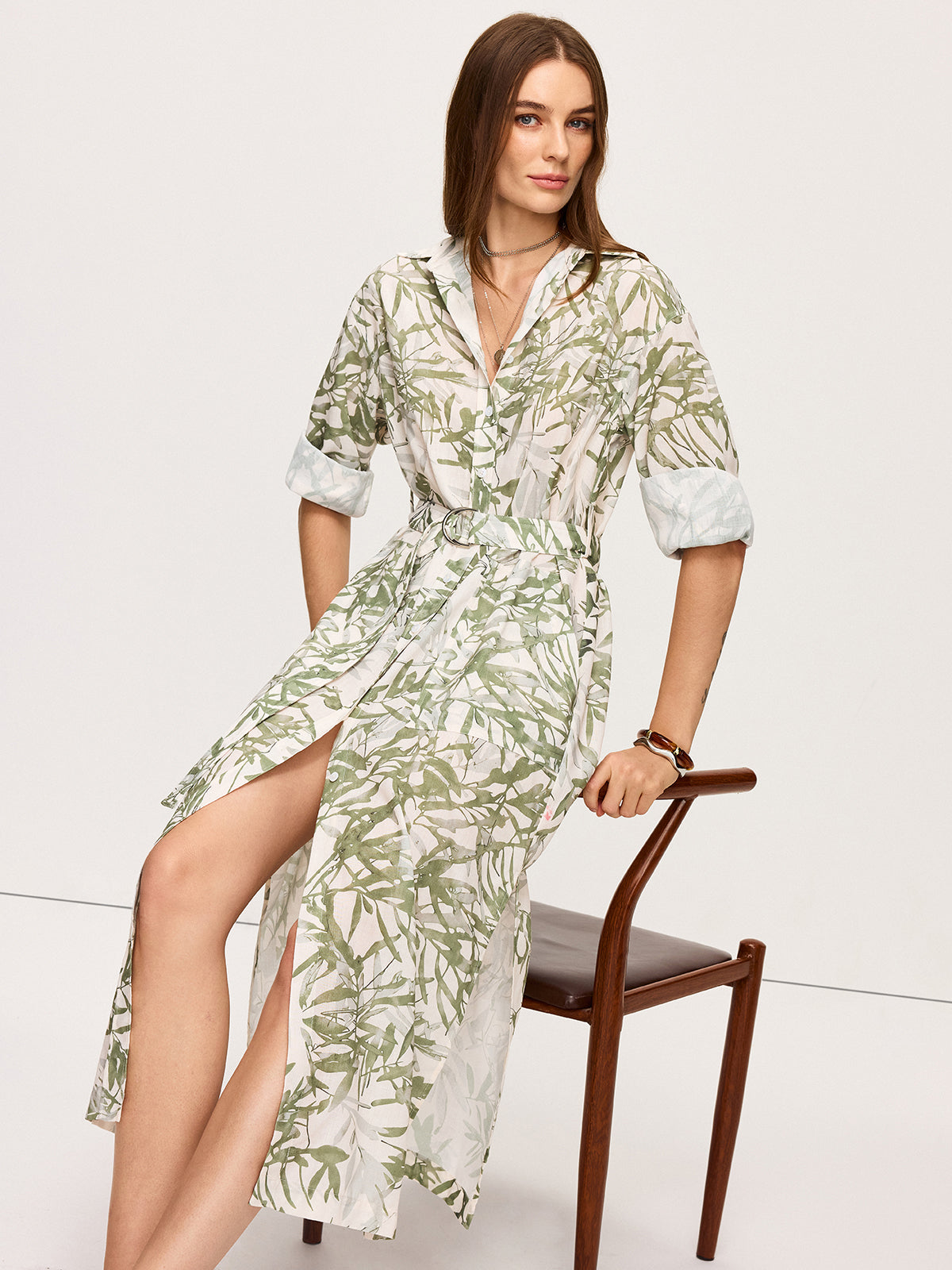 LA FINE FLEUR Leaf Print Belted Midi Dress with white and green pattern, side slits.