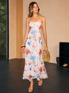 A semi-sheer maxi dress with floral pattern, featuring delicate detailing and airy summer style.