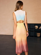 A gradient mesh backless evening gown fading from light blue to yellow and red.