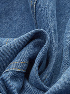 Classic Denim Vest with button closure, blue polyester denim, yellow stitching, textured woven patterns.