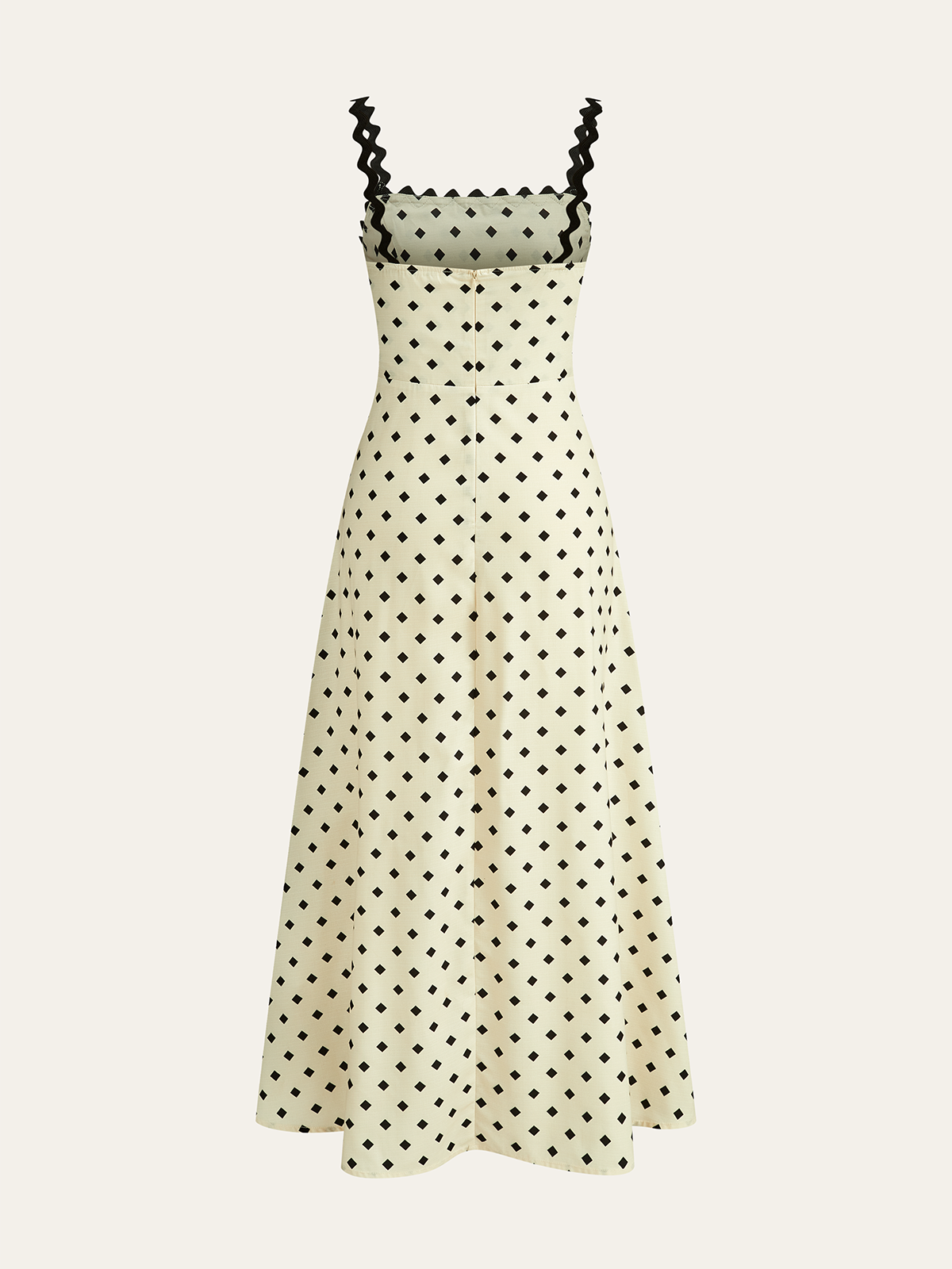 Cream midi dress with black square dots, scalloped straps, buttoned bodice, and flared skirt.