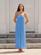 Light blue LA FINE FLEUR maxi dress with pleats and thin spaghetti straps. Effortlessly chic.