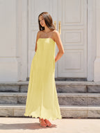 LA FINE FLEUR Spaghetti Strap Pleated Maxi Dress in a breezy, elegant silhouette.