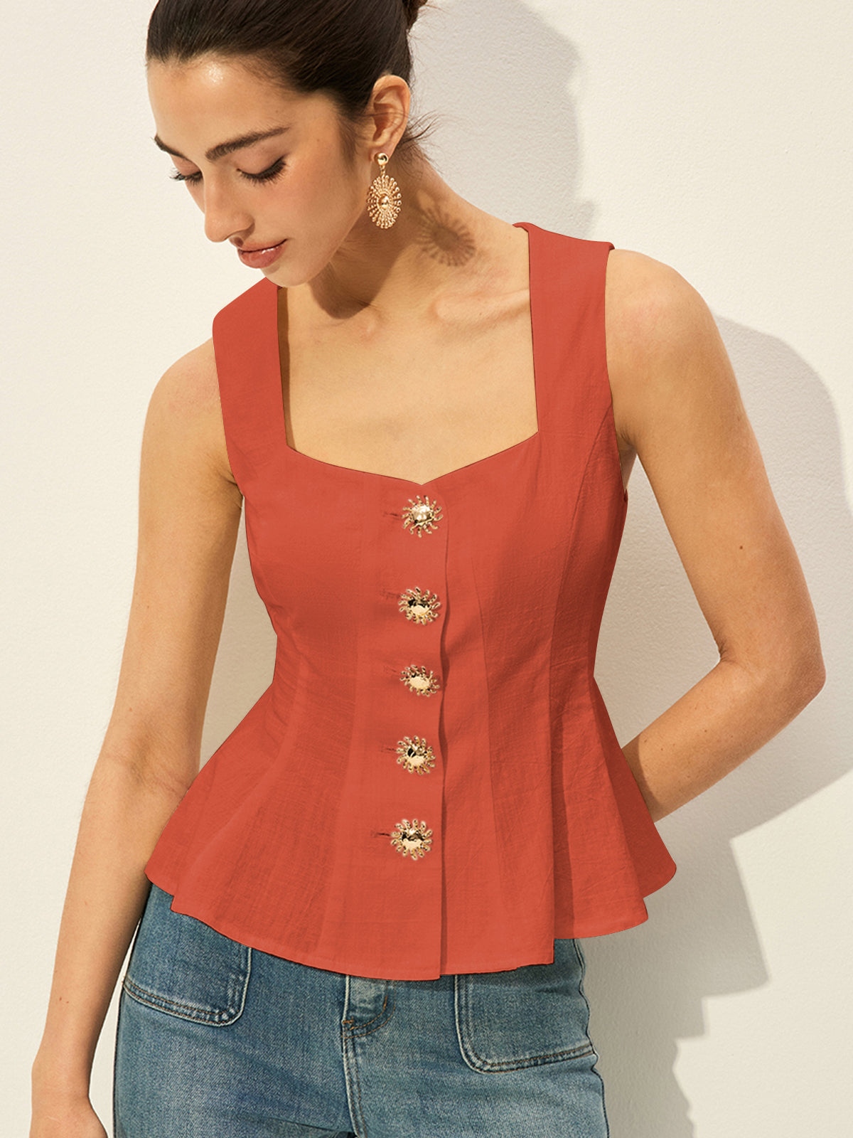 Orange BYPINKYPARIS square neckline buttoned peplum blouse paired with classic denim jeans.