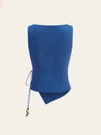 Blue linen sleeveless top with square neckline, wrap-tie, asymmetrical hem, beaded lace-up side.