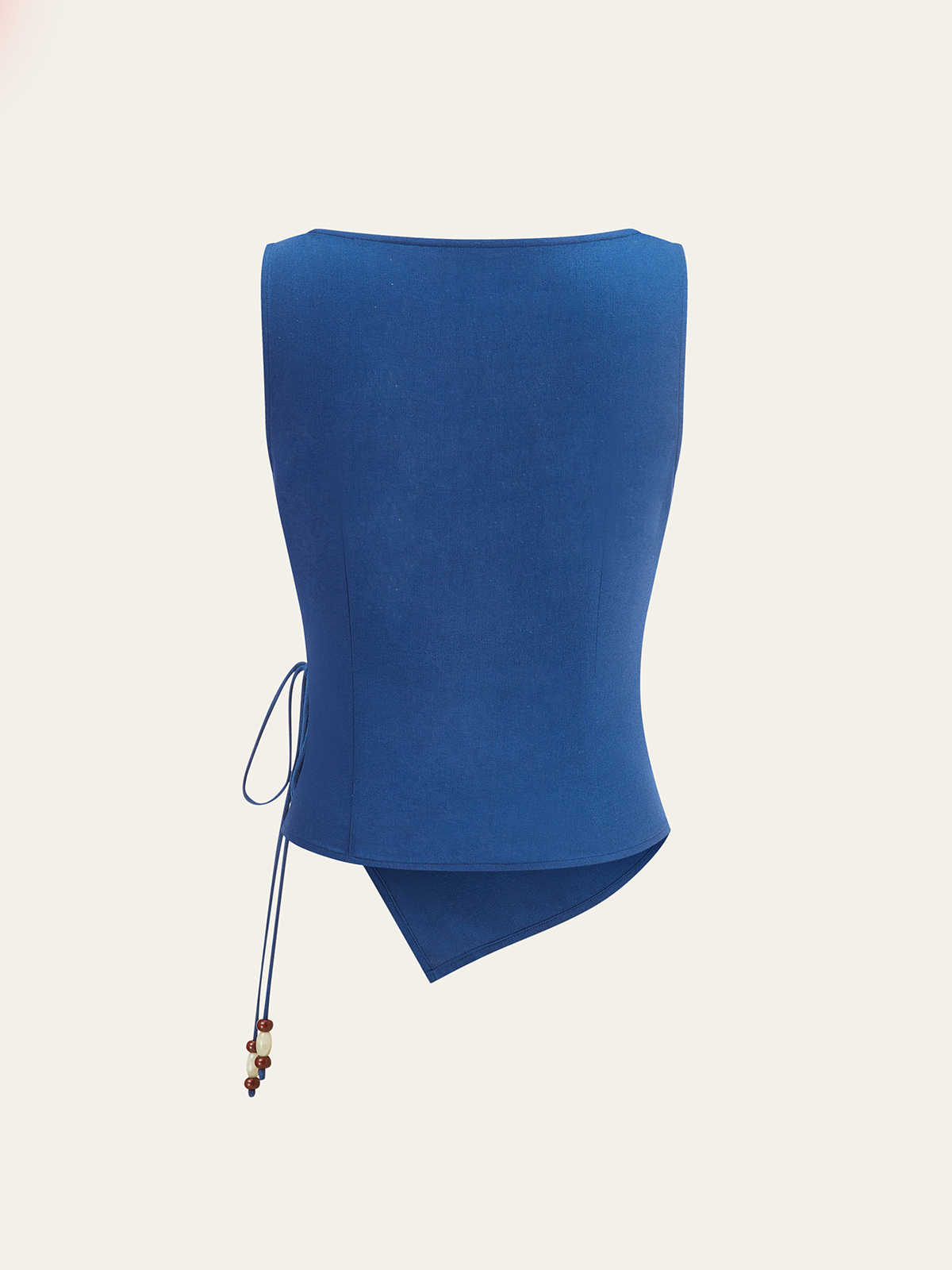 Blue linen sleeveless top with square neckline, wrap-tie, asymmetrical hem, beaded lace-up side.