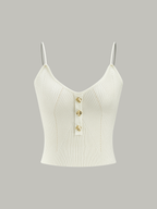 White ribbed knit cami top with thin straps, V-neckline, and metal button details.