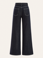 High-waisted dark navy denim trousers with white contrast stitching and two back patch pockets.