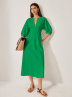 LA FINE FLEUR’s bright green cotton and linen dress with puff sleeves is featured.