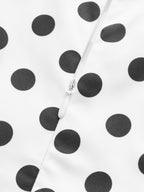 White midi sleeveless dress in polyester with black polka dots and central white zipper.