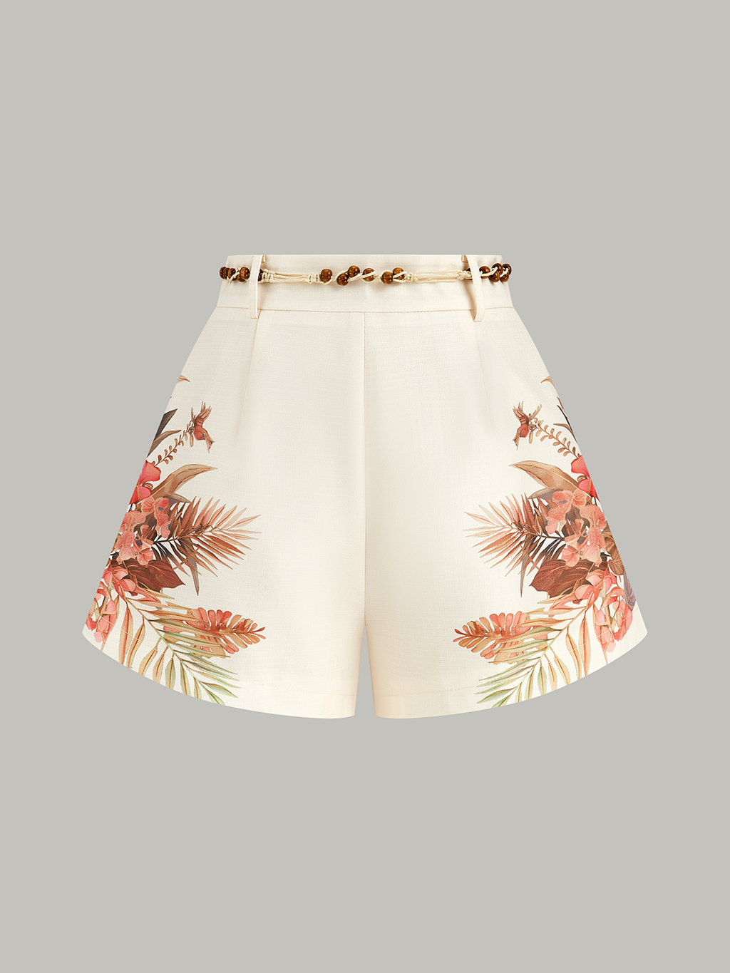Mid-waist cream shorts with a tropical floral belt and delicate beaded waist detailing.