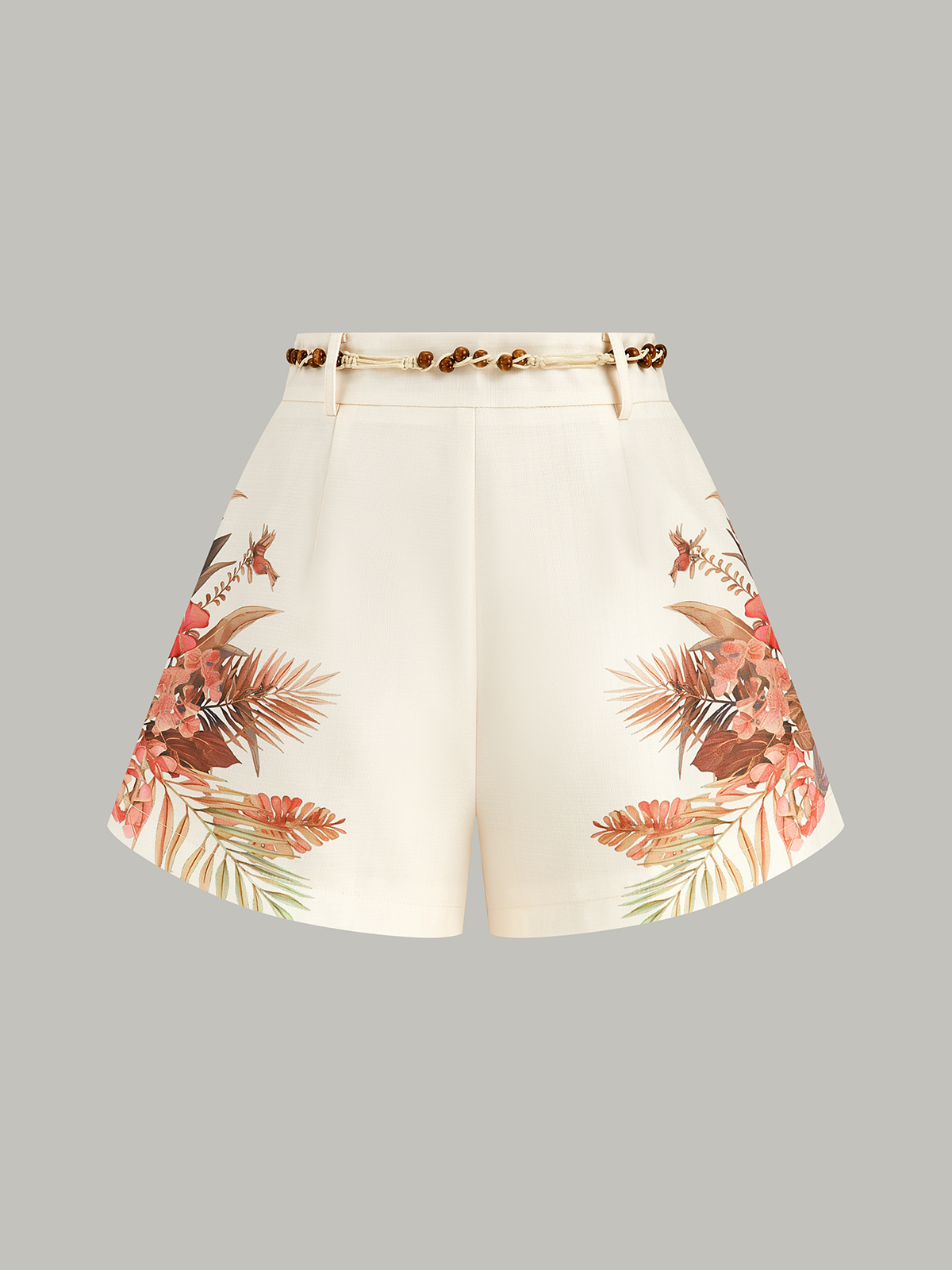 Mid-waist cream shorts with a tropical floral belt and delicate beaded waist detailing.