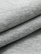 Soft, smooth light gray heathered sweatshirt fabric layers, ideal for crew neck sweatshirts.