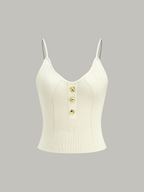 Cream ribbed knit cami top with spaghetti straps, deep V-neckline, front metal buttons.