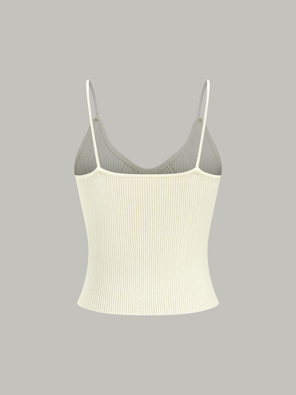 Sleeveless light beige ribbed knit cami top with thin straps and subtle metal buttons.
