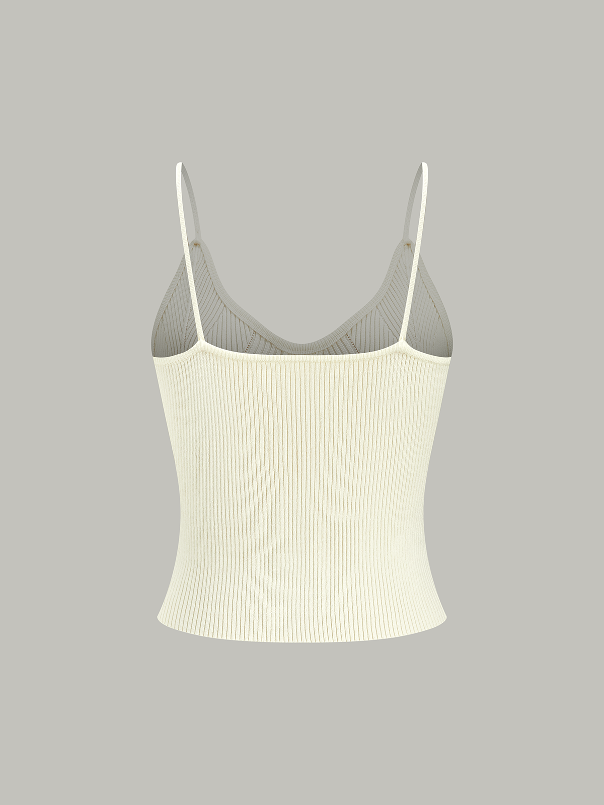 Sleeveless light beige ribbed knit cami top with thin straps and subtle metal buttons.