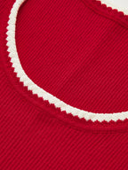 Red ribbed knit tank top with cream scalloped round neckline and contrast trim details.