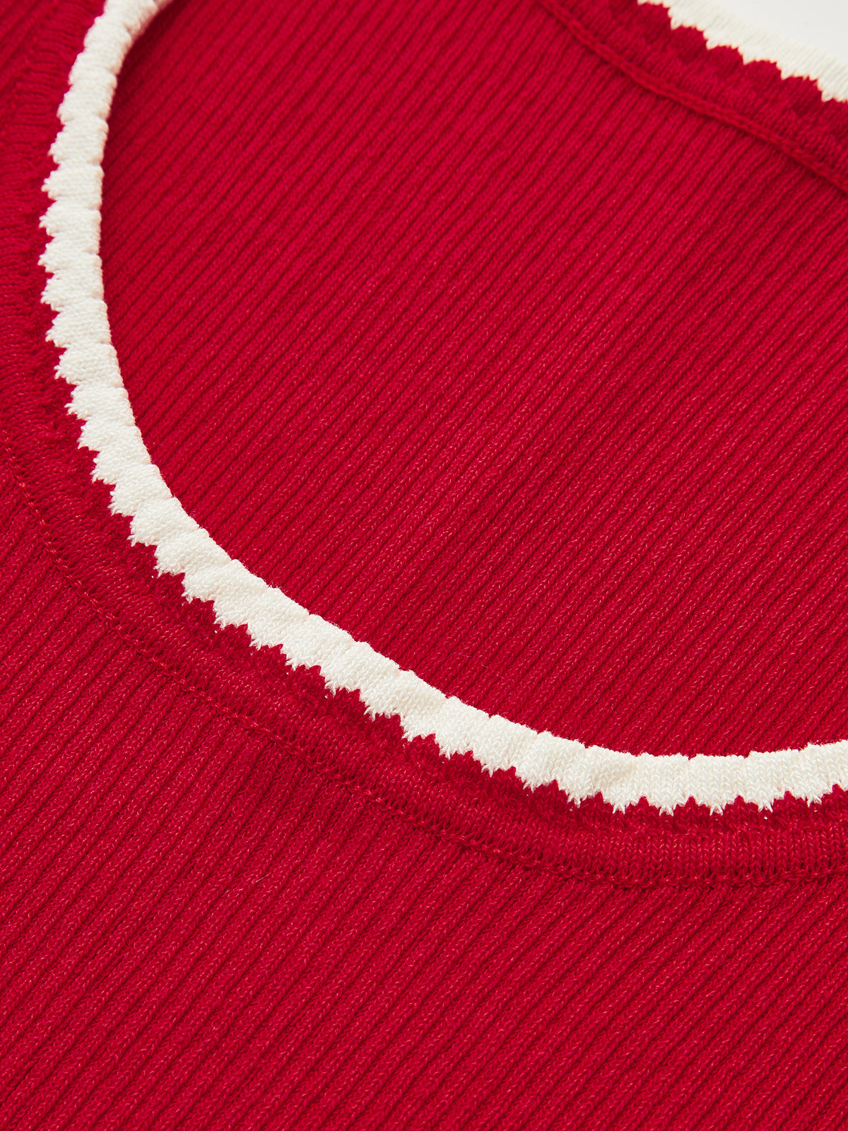 Red ribbed knit tank top with cream scalloped round neckline and contrast trim details.
