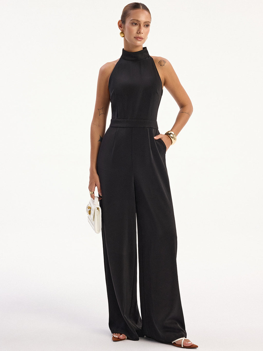 LA FINE FLEUR Satin Halter Neck Jumpsuit featuring a back slit and elegant finish.