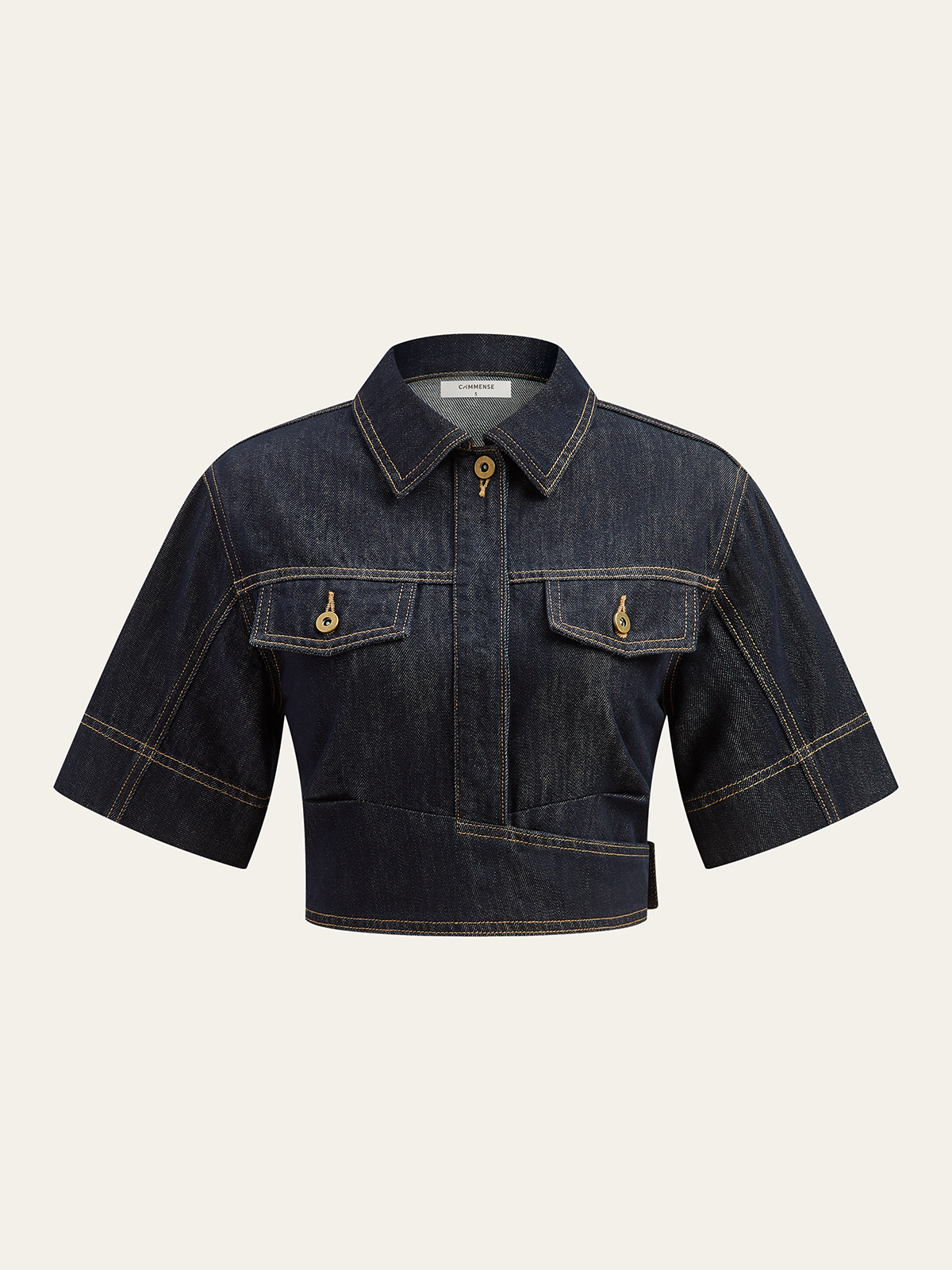 Cropped dark denim top with collar, front zipper, chest pockets, gold buttons, tan stitching.