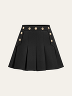 Black pleated mini skirt with gold double-row buttons and two front flap pockets.