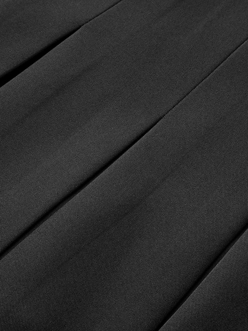Black LA FINE FLEUR pleated mini skirt with decorative buttons, diagonal lines, and highlighted folds.