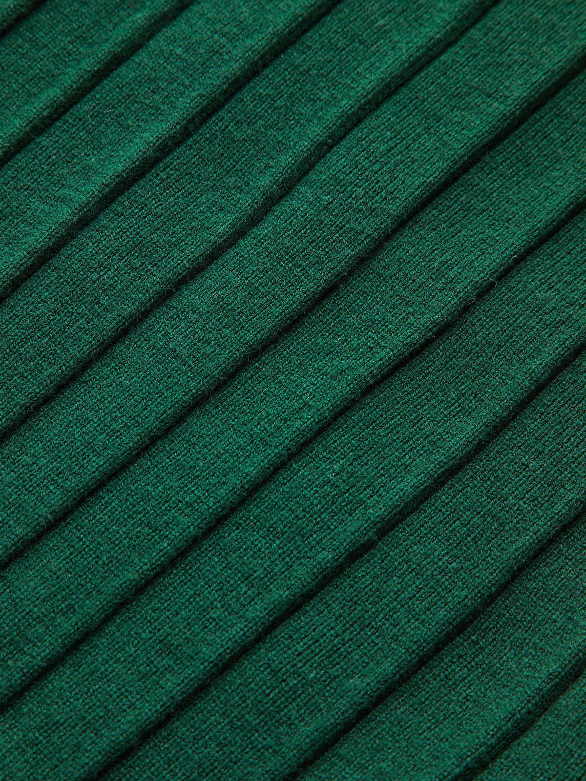 Green ribbed knit vest with diagonal raised lines and subtle metallic accents on cap sleeves.