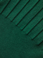 A dark green ribbed knit vest with metallic detail and distinctive cap sleeves.