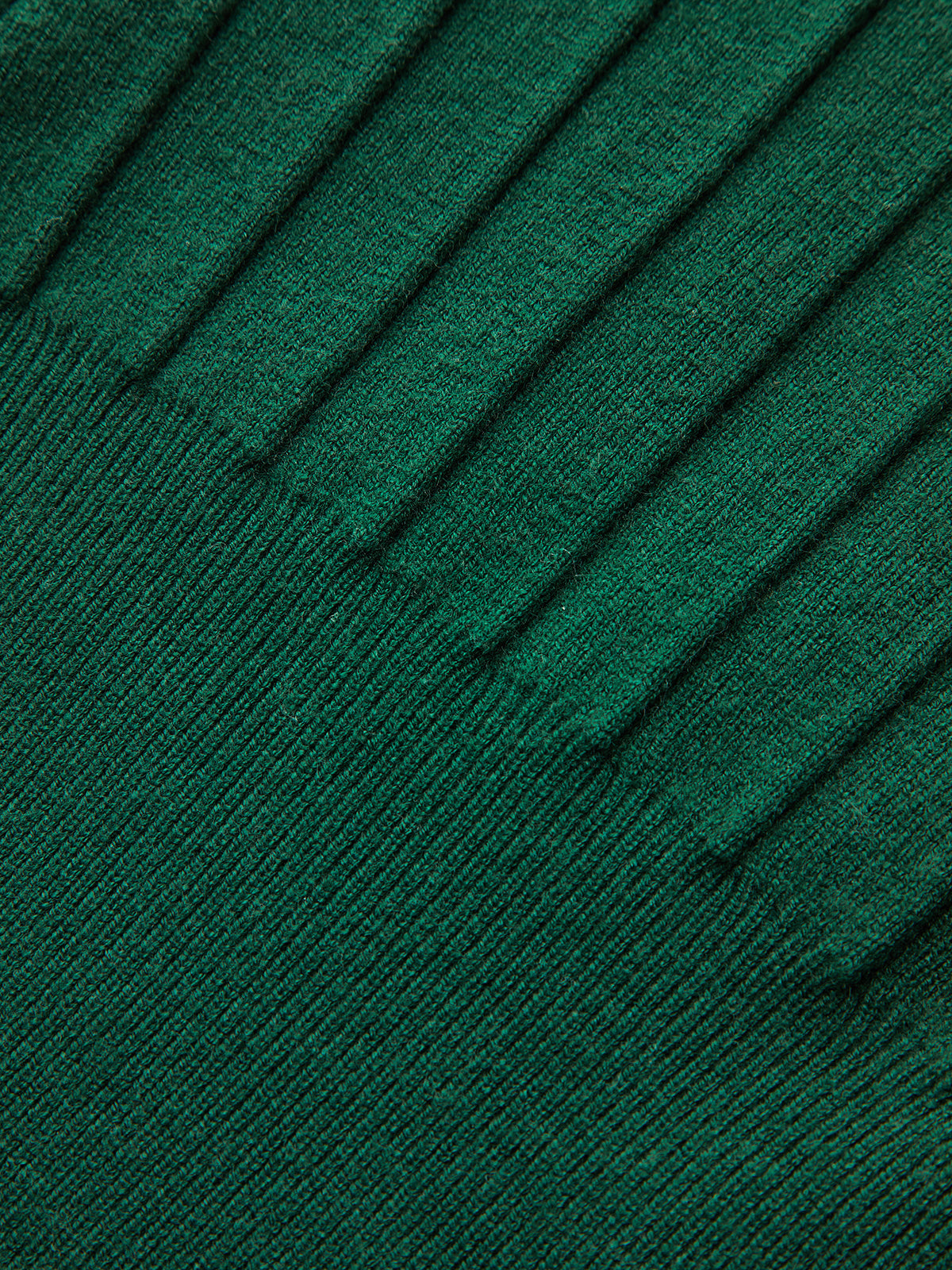 A dark green ribbed knit vest with metallic detail and distinctive cap sleeves.