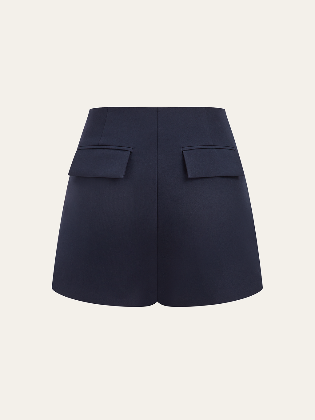 Asymmetrical metallic accent skort with high waist and unique back flap pockets detailing.