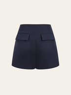 Asymmetrical metallic accent skort with high waist and unique back flap pockets detailing.