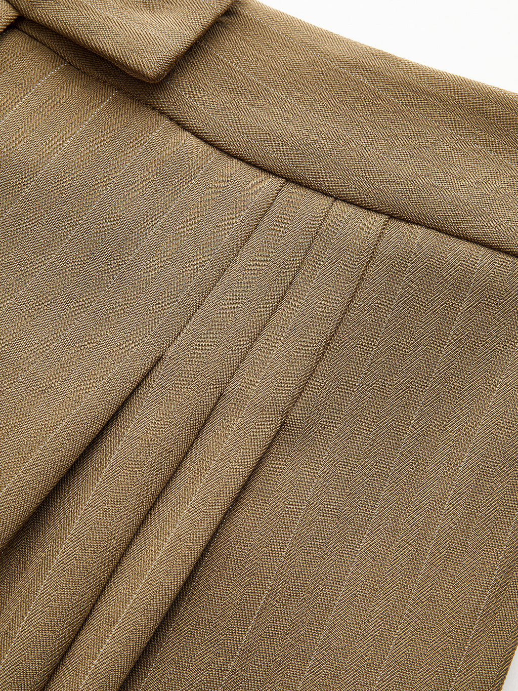 Striped pleated wide-leg trousers with detailed pleats, defined waistband, and fine textured fabric.