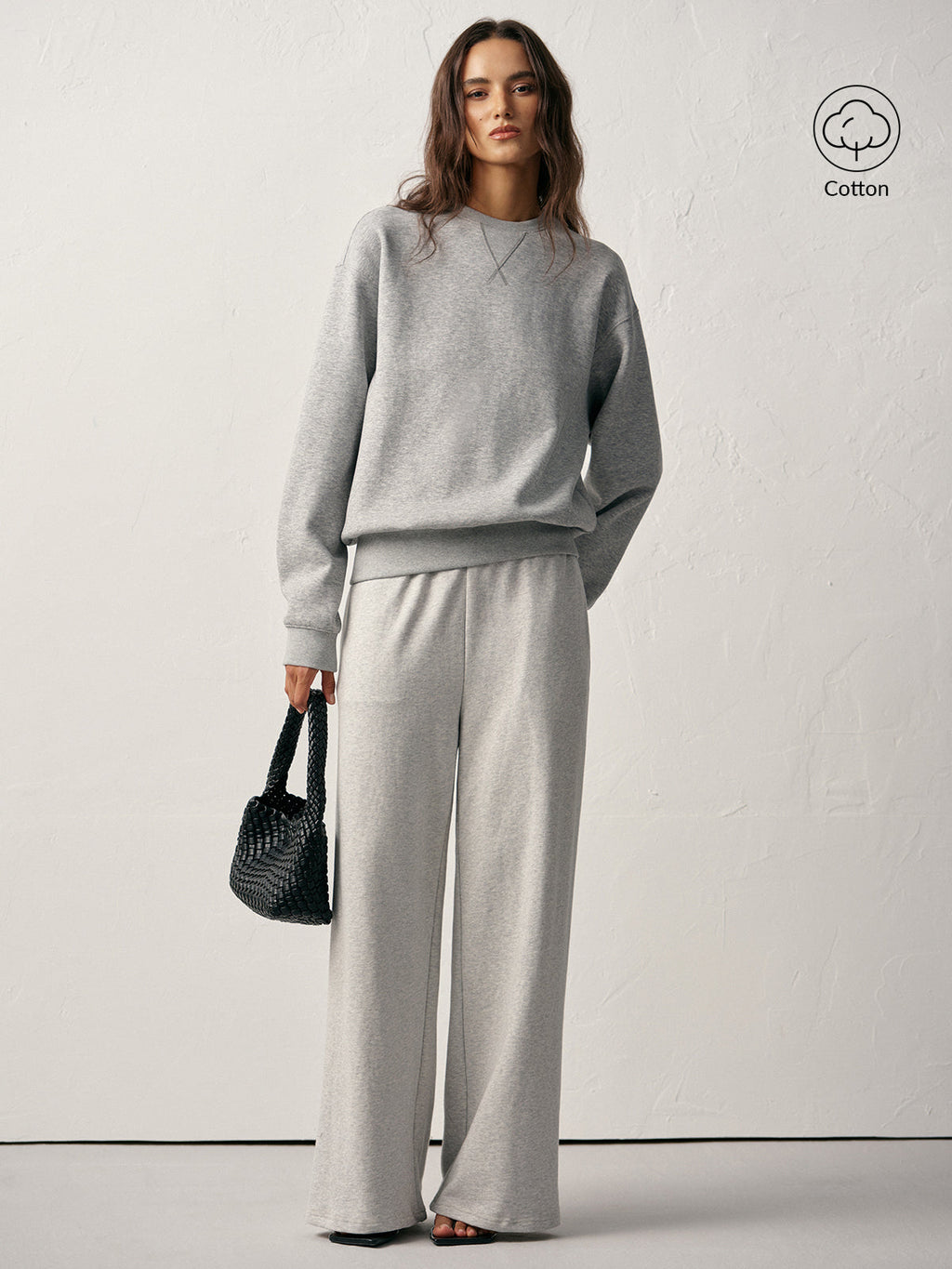 Light grey cotton blend crew neck sweatshirt and matching pants with a comfortable fit.