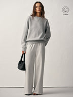 Light grey cotton blend crew neck sweatshirt and matching pants with a comfortable fit.