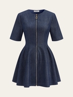 Dark blue denim zip-front mini dress with short sleeves, fitted waist, and flared skirt.