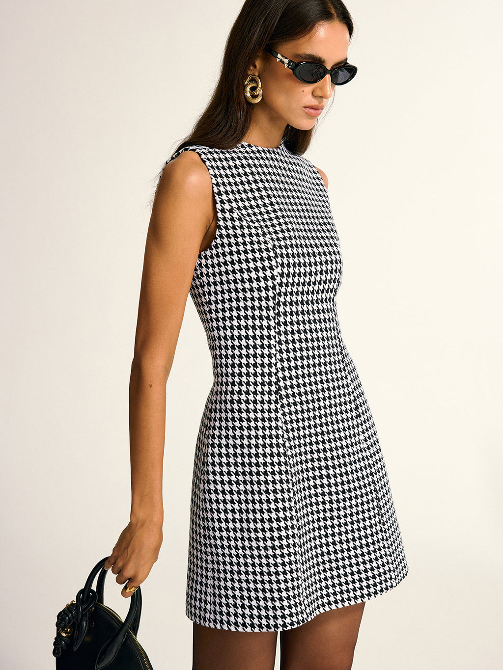 A LA FINE FLEUR chic houndstooth pattern sleeveless A-line mini dress is displayed.