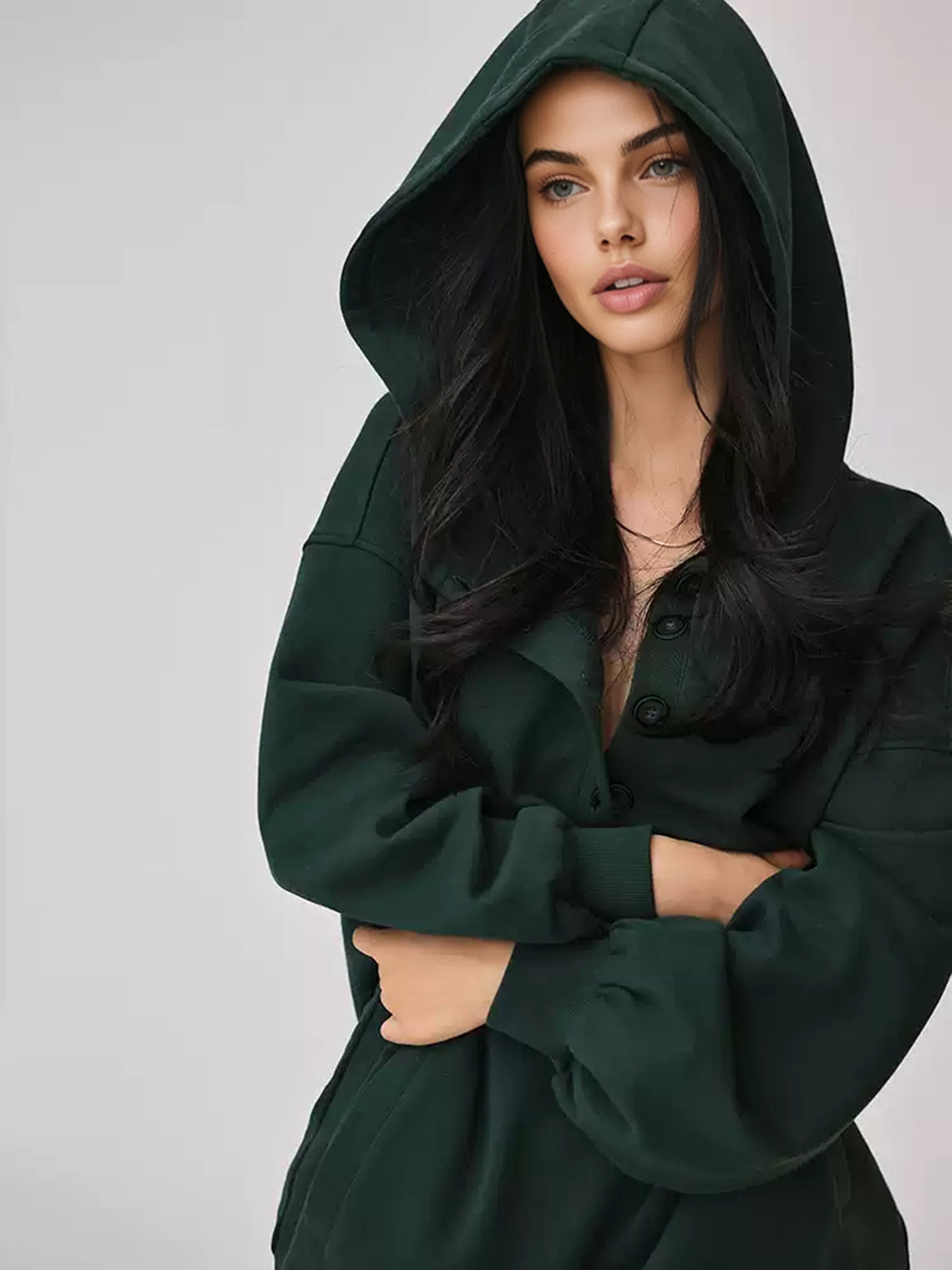 A dark green Cozy Large Hoodie with buttons and an attached hood from LA FINE FLEUR.