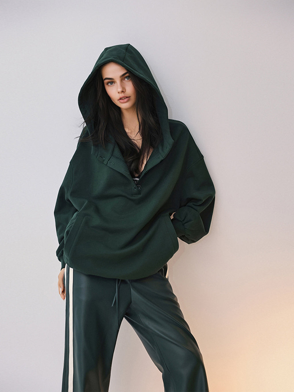 Cozy large hoodie with buttons, attached hood, and matching pants featuring white side stripes.
