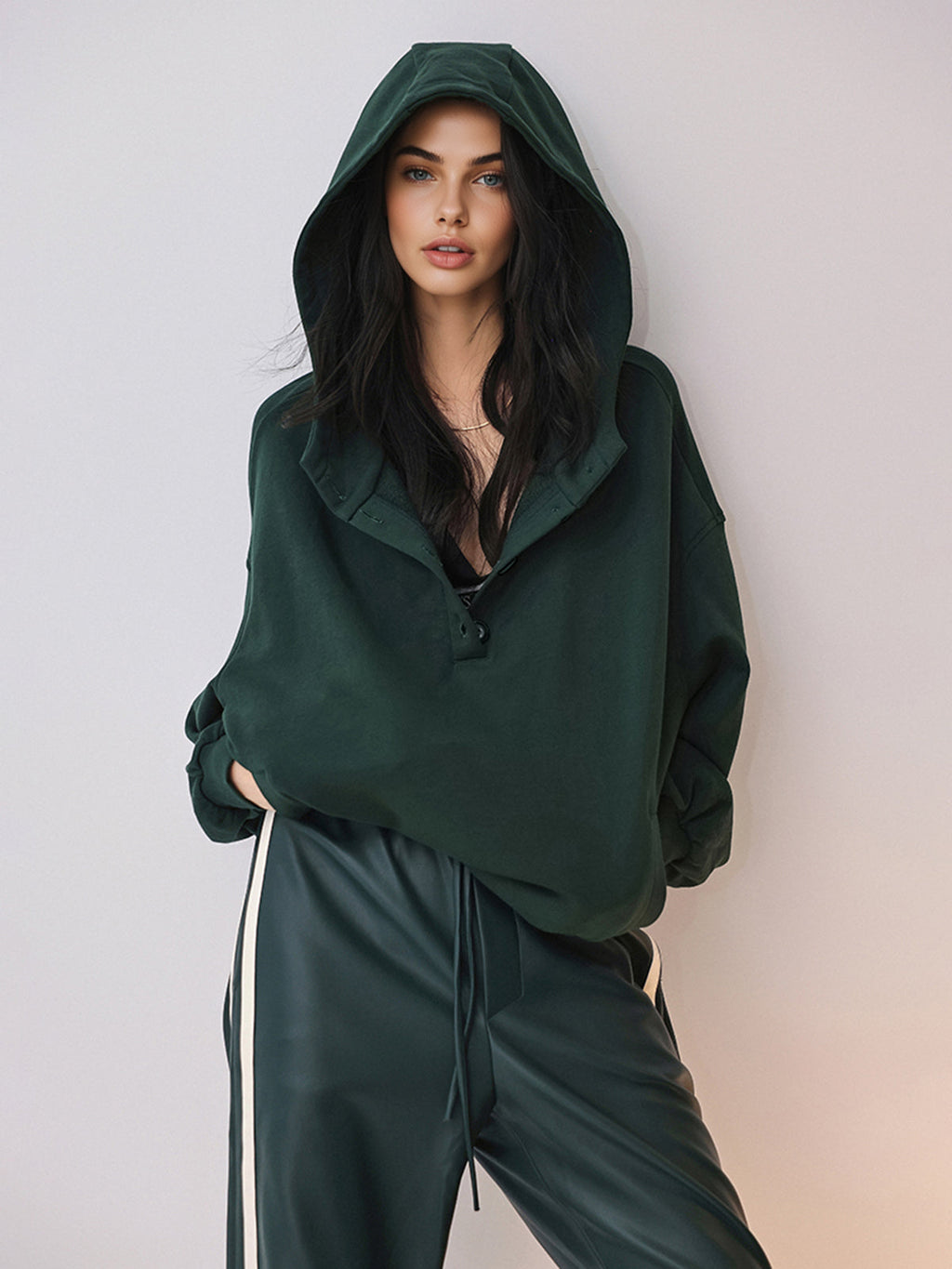 A cozy large hoodie with buttons and attached hood, plus matching pants with white side stripes.