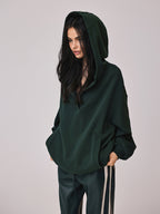 The LA FINE FLEUR Cozy Large Hoodie features buttons and an attached hood.