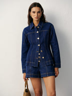 The LA FINE FLEUR fitted denim jacket with metal buttons and matching high-waisted shorts.