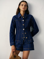 A fitted denim jacket with metal buttons paired with matching regular fit denim shorts.