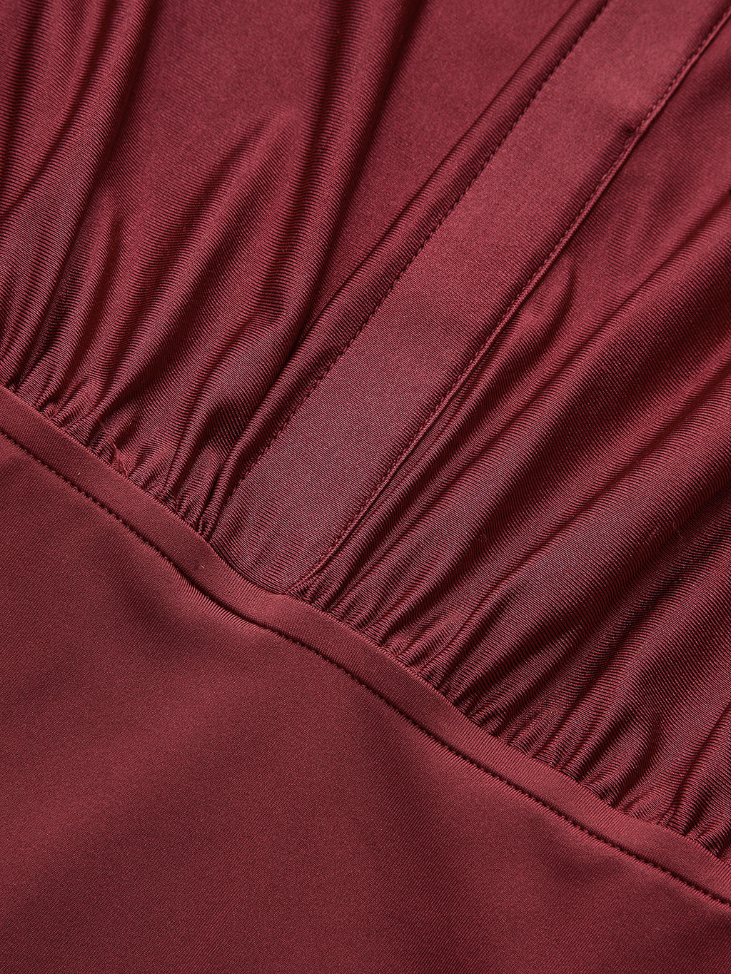 Maroon long sleeve bodysuit with a collar, gathered ruching, and subtle stitched details.