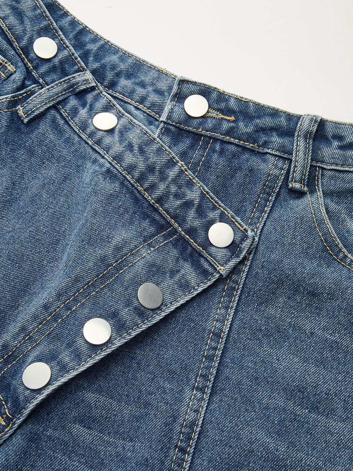 Asymmetric Jeans with Unique Button Accents