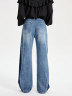 Two-tone wide leg barrel jeans with a light blue wash, mid-rise, and back pockets.