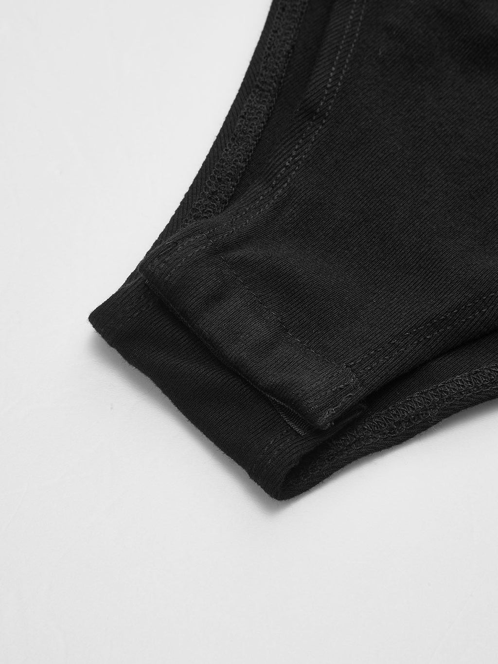 Ribbed black hem with detailed stitching on the LA FINE FLEUR sheer crew neck bodysuit.